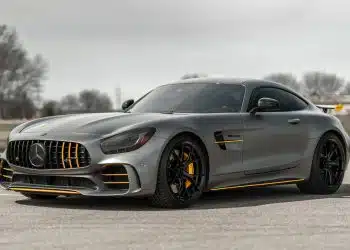 black mercedes benz coupe on gray asphalt road