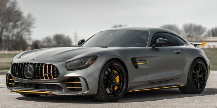 black mercedes benz coupe on gray asphalt road