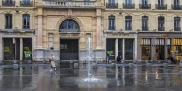 a large building with a fountain in front of it