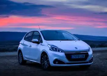 silver honda sedan on brown sand during sunset